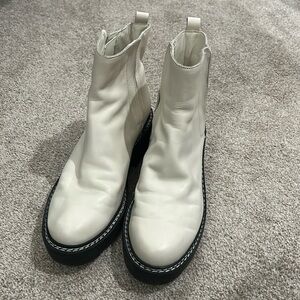 Woman’s white Calvin Klein boots